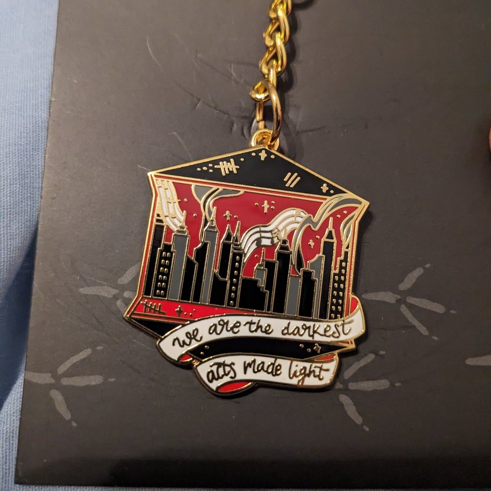 This Savage Song enamel keychain